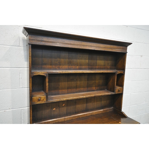 1258 - A REPRODUCTION OAK DRESSER, with three drawers, width 137cm x depth 49cm x depth 159cm x 85cm