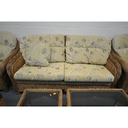 1262 - A PLATT AND HILL WICKER THREE PIECE LOUNGE SUITE, comprising a two seater sofa, a pair of  armchair,... 