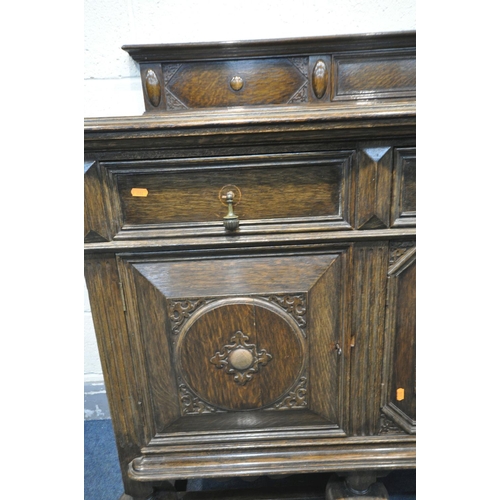 1277 - A 20TH CENTURY SOLID OAK SIDEBOARD, with a raised back, three drawers, left drawer with green baize ... 