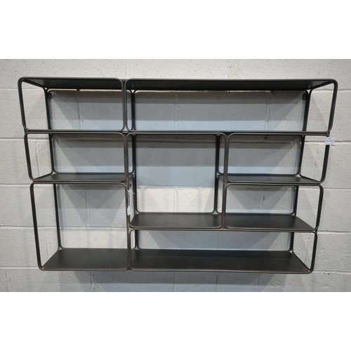 1394 - AN INDUSTRIAL METAL HANGING GEOMETRIC WALL SHELF, with five shelves, and eight sections, length 120c... 