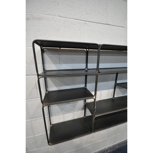 1394 - AN INDUSTRIAL METAL HANGING GEOMETRIC WALL SHELF, with five shelves, and eight sections, length 120c... 