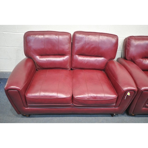 1411 - AN SCS CLARET TWO PIECE LOUNGE SUITE, comprising a three seater sofa 196cm, and a two seater sofa 15... 