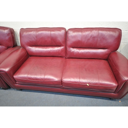 1411 - AN SCS CLARET TWO PIECE LOUNGE SUITE, comprising a three seater sofa 196cm, and a two seater sofa 15... 