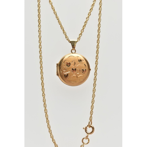 104 - 9CT GOLD LOCKET PENDANT WITH CHAIN, circular locket detailing engraved hearts, opens to reveal two v... 