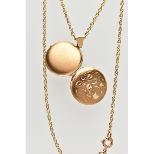 104 - 9CT GOLD LOCKET PENDANT WITH CHAIN, circular locket detailing engraved hearts, opens to reveal two v... 