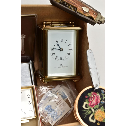 121 - A BOX OF MISCELLANEOUS ITEMS, to include a 'Matthew Norman' carriage clock, key wound with papers, a... 