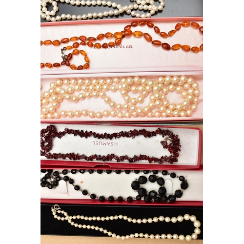 122 - A BOX OF COSTUME JEWELLERY, to include a garnet bead necklace fitted with a lobster clasp, two cultu... 