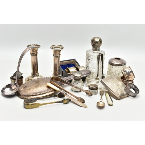 127 - AN ASSORTMENT OF SILVER AND WHITE METAL, to include two matching weighted base candle sticks, hallma... 