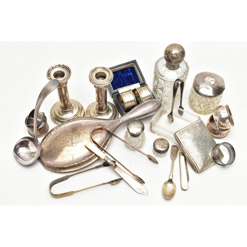 127 - AN ASSORTMENT OF SILVER AND WHITE METAL, to include two matching weighted base candle sticks, hallma... 