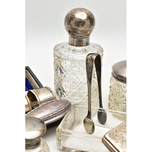 127 - AN ASSORTMENT OF SILVER AND WHITE METAL, to include two matching weighted base candle sticks, hallma... 