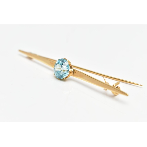 13 - A YELLOW METAL ZIRCON BAR BROOCH, set with a circular blue zircon, measuring approximately 8.5mm x 8... 