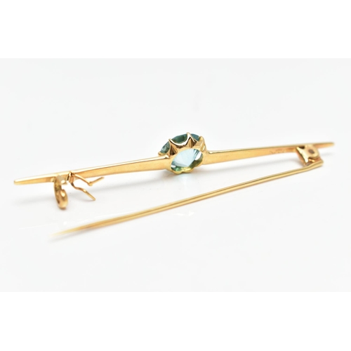 13 - A YELLOW METAL ZIRCON BAR BROOCH, set with a circular blue zircon, measuring approximately 8.5mm x 8... 