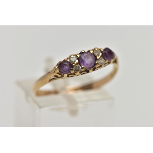 19 - A 9CT GOLD AMETHYST AND CUBIC ZIRCONIA DRESS RING, the graduated circular cut amethysts and cubic zi... 