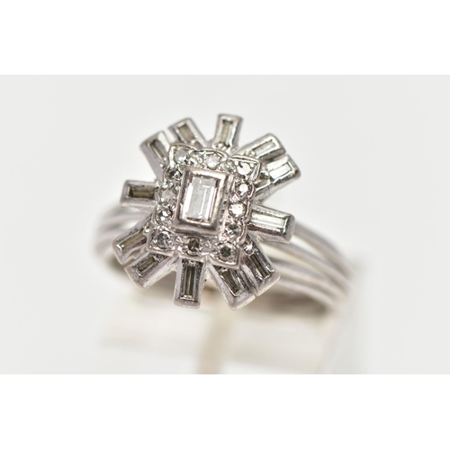 2 - A WHITE METAL DIAMOND CLUSTER RING, raised cluster centring on a rectangular cut diamond in a collet... 