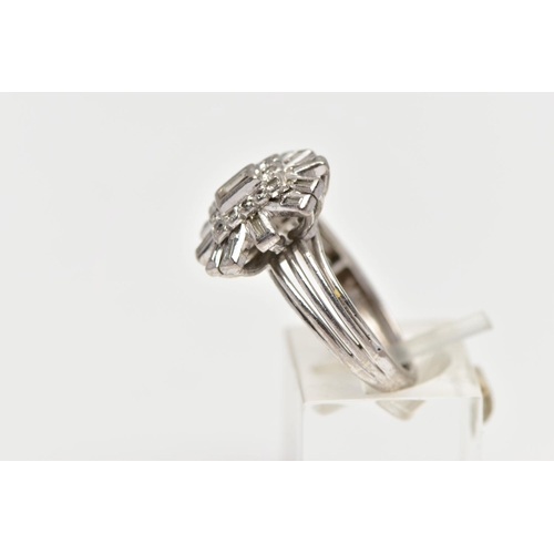 2 - A WHITE METAL DIAMOND CLUSTER RING, raised cluster centring on a rectangular cut diamond in a collet... 