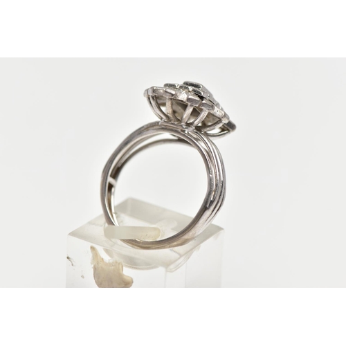 2 - A WHITE METAL DIAMOND CLUSTER RING, raised cluster centring on a rectangular cut diamond in a collet... 