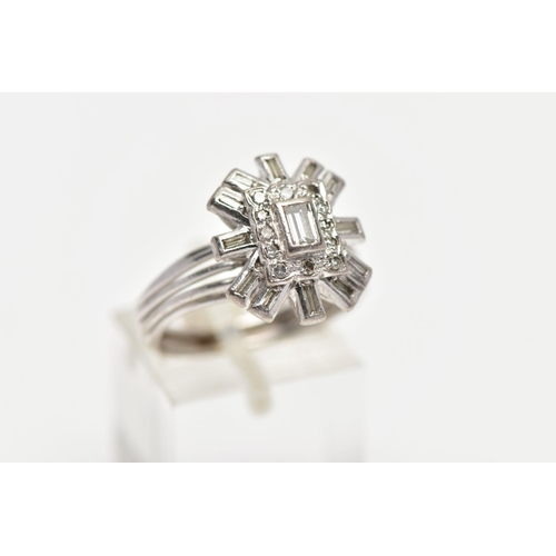 2 - A WHITE METAL DIAMOND CLUSTER RING, raised cluster centring on a rectangular cut diamond in a collet... 