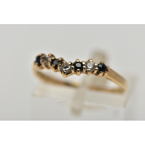 22 - A 9CT GOLD SAPPHIRE AND CUBIC ZIRCONIA WISHBONE RING, the circular cut sapphire and alternately set ... 