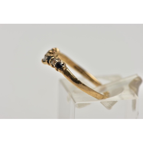 22 - A 9CT GOLD SAPPHIRE AND CUBIC ZIRCONIA WISHBONE RING, the circular cut sapphire and alternately set ... 