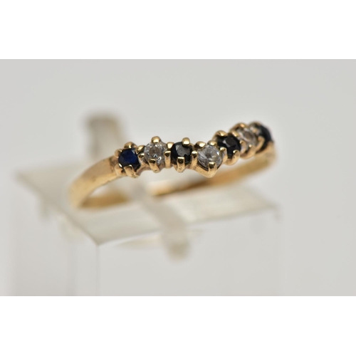 22 - A 9CT GOLD SAPPHIRE AND CUBIC ZIRCONIA WISHBONE RING, the circular cut sapphire and alternately set ... 