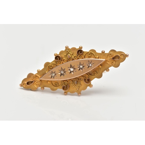 23 - AN EARLY 20TH CENTURY 9CT GOLD DIAMOND BROOCH, designed as a marquise panel, star set with five rose... 