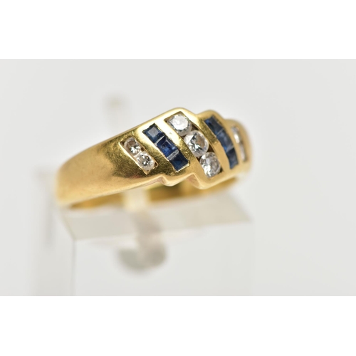 27 - A YELLOW METAL SAPPHIRE AND DIAMOND DRESS RING, of geometric design, the principal brilliant cut cen... 