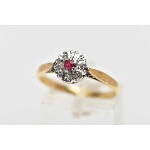 3 - A YELLOW METAL DIAMOND AND RUBY CLUSTER RING, flower design, centring on a circular cut glass filled... 