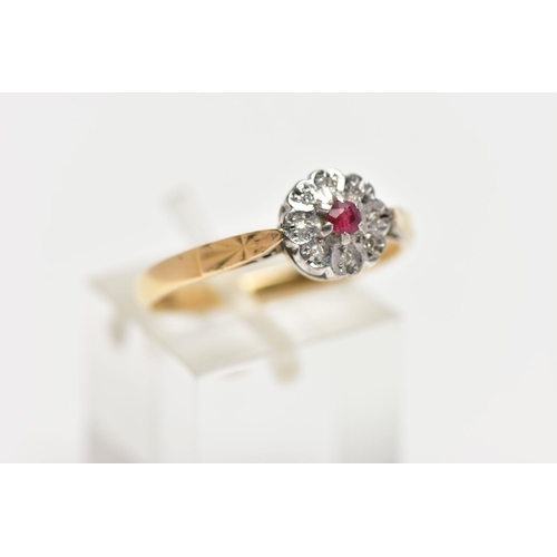 3 - A YELLOW METAL DIAMOND AND RUBY CLUSTER RING, flower design, centring on a circular cut glass filled... 