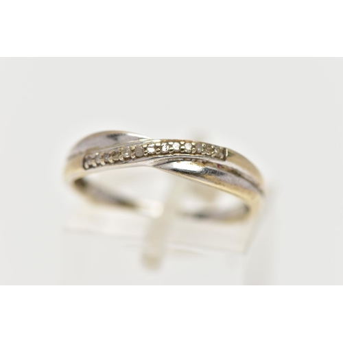 30 - A 9CT WHITE GOLD DIAMOND DRESS RING, the single cut diamond line, set across an asymmetric plain ban... 