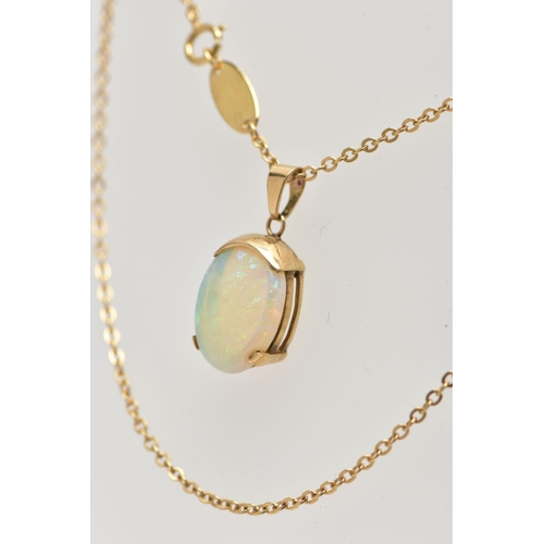 32 - A YELLOW METAL OPAL PENDANT WITH CHAIN, the oval opal cabochon, with yellow metal cap, tapered surmo... 