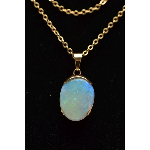 32 - A YELLOW METAL OPAL PENDANT WITH CHAIN, the oval opal cabochon, with yellow metal cap, tapered surmo... 