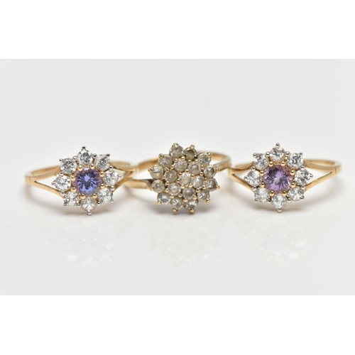 4 - THREE 9CT GOLD CLUSTER RINGS, the first a colourless cubic zirconia cluster ring, pinched shoulders ... 