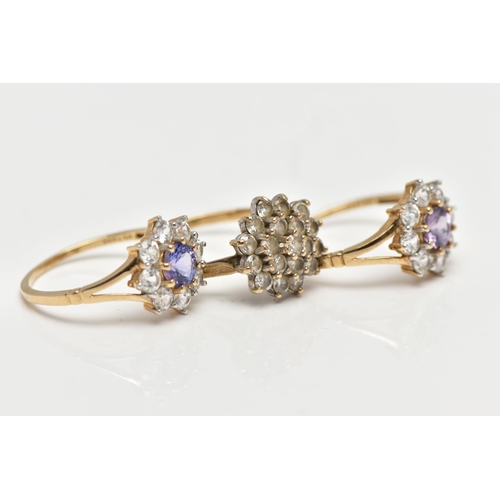 4 - THREE 9CT GOLD CLUSTER RINGS, the first a colourless cubic zirconia cluster ring, pinched shoulders ... 