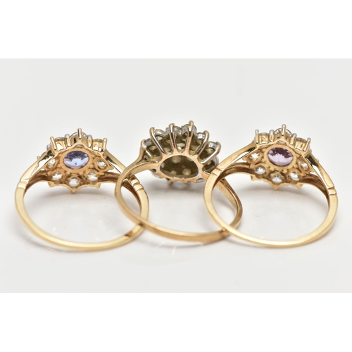 4 - THREE 9CT GOLD CLUSTER RINGS, the first a colourless cubic zirconia cluster ring, pinched shoulders ... 