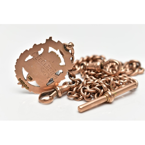 60 - AN EARLY 20TH CENTURY 9CT GOLD ALBERT CHAIN AND FOB, a rose gold graduated curb link chain, fitted w... 