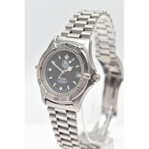 69 - A 'TAG HEUER' QUARTZ WRISTWATCH, round black dial signed 'Tag Heuer, 2000 professional 200 metres', ... 