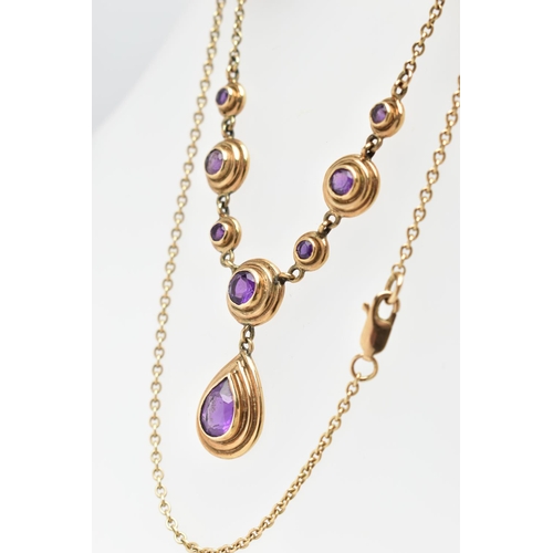 79 - A 9CT GOLD AMETHYST NECKLACE, the pear cut collet amethyst drop, suspended from a circular cut colle... 