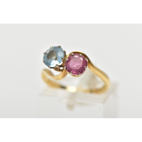 8 - AN 18CT GOLD DRESS RING, a circular cut aquamarine and circular cut glass filled ruby, approximate d... 