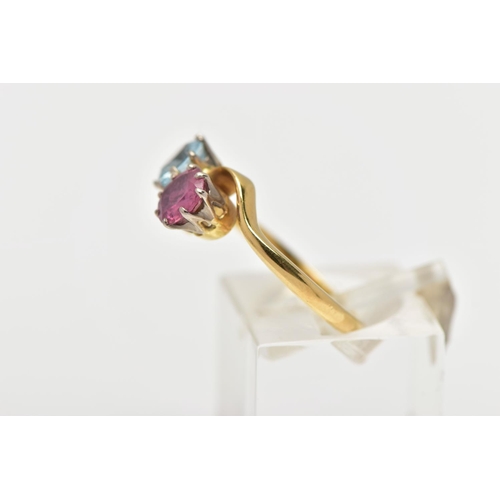 8 - AN 18CT GOLD DRESS RING, a circular cut aquamarine and circular cut glass filled ruby, approximate d... 