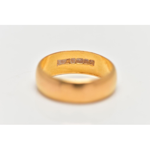 81 - A 22CT GOLD BAND RING, designed as a plain band, hallmarked Birmingham 1986, approximate width 5mm, ... 