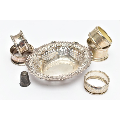 98 - A SELECTION OF SILVER TABLEWARE, to include five early 20th century variously designed silver napkin... 