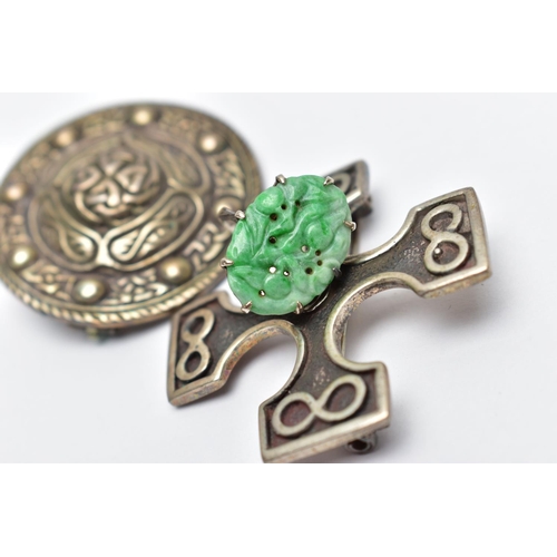 99 - TWO SCOTTISH SILVER BROOCHES, the first a silver cross, detailed with four infinity symbols, approxi... 