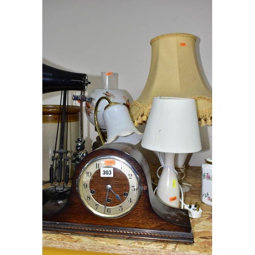 303 - A GROUP OF LAMPS comprising an oak cased mantel clock (with key), three table lamps with shades, a b... 