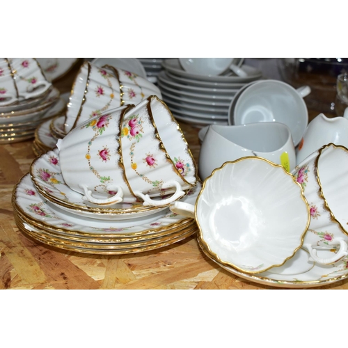 307 - A ROSLYN BONE CHINA TEA SET TOGETHER WITH A ROSENTHAL 'RAYMOND LOWEY' TEA SET,  comprising six cups,... 