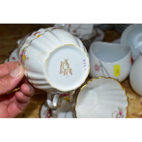 307 - A ROSLYN BONE CHINA TEA SET TOGETHER WITH A ROSENTHAL 'RAYMOND LOWEY' TEA SET,  comprising six cups,... 