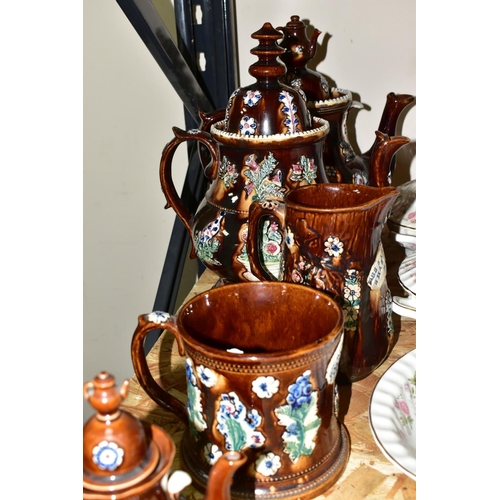 323 - SEVEN PIECES OF MEASHAM BARGEWARE, comprising two large teapots, one having a teapot shaped finial a... 