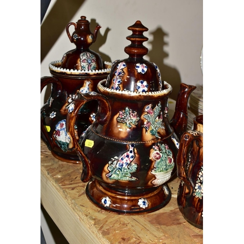 323 - SEVEN PIECES OF MEASHAM BARGEWARE, comprising two large teapots, one having a teapot shaped finial a... 