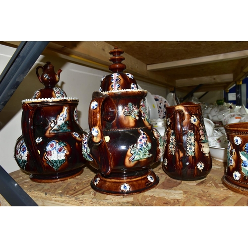 323 - SEVEN PIECES OF MEASHAM BARGEWARE, comprising two large teapots, one having a teapot shaped finial a... 