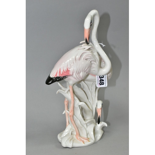 348 - A GOEBEL POINTER FIGURE AND A KARL ENS FIGURE GROUP OF FLAMINGOS, the brown and white pointer with i... 