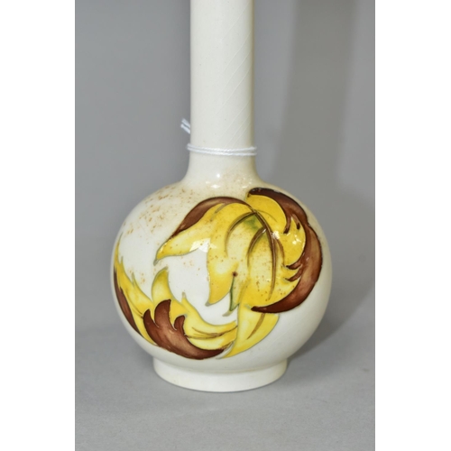 351 - A MOORCROFT POTTERY BUD VASE, 'Leaves in the Wind' yellow and brown leaf pattern on a cream ground, ... 